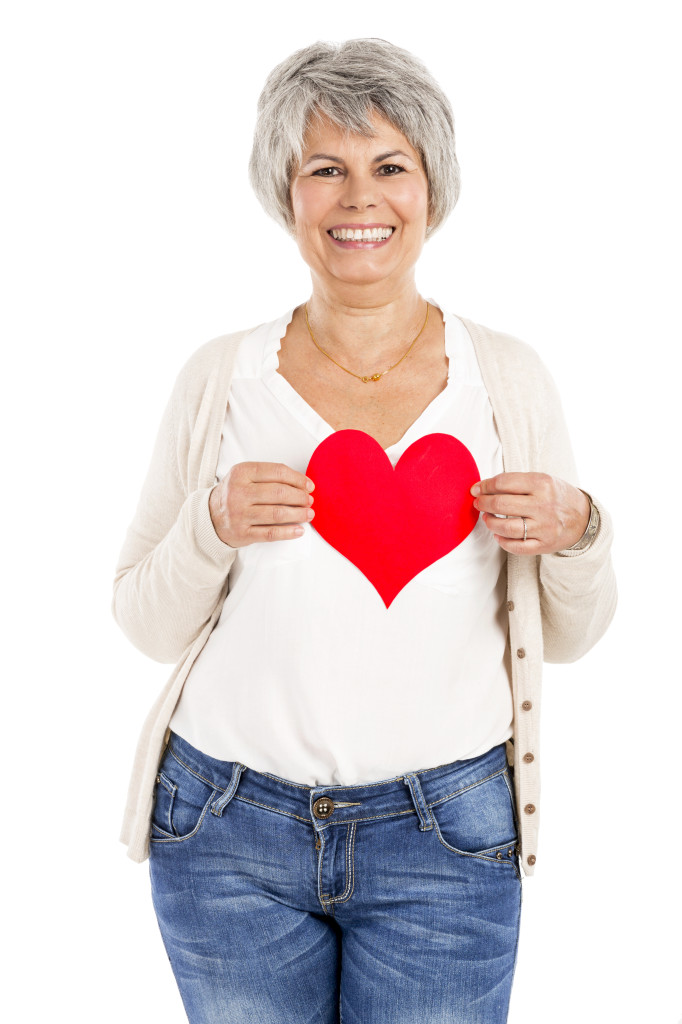 Holding a heart in her hands