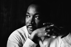 Atlanta, Georgia, USA --- Martin Luther King Jr. listens at a meeting of the SCLC, the Southern Christian Leadership Conference, at a restaurant in Atlanta. The SCLC is a civil rights organization formed by Martin Luther King after the success of the Montgomery bus boycott. --- Image by © Flip Schulke/CORBIS