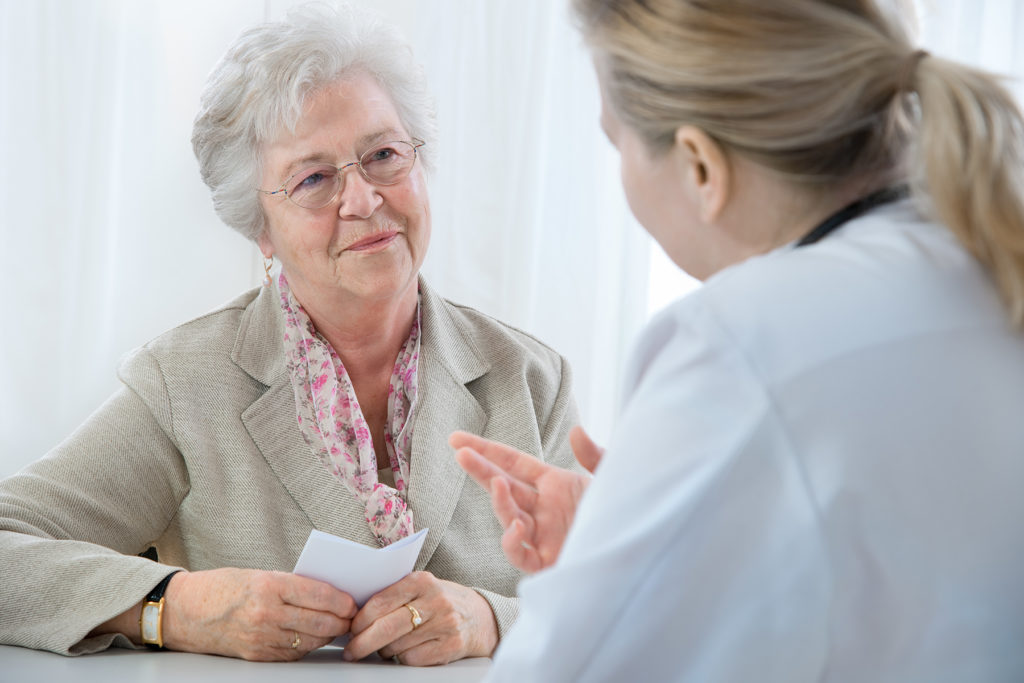 Nurse discussing care plan with patient.