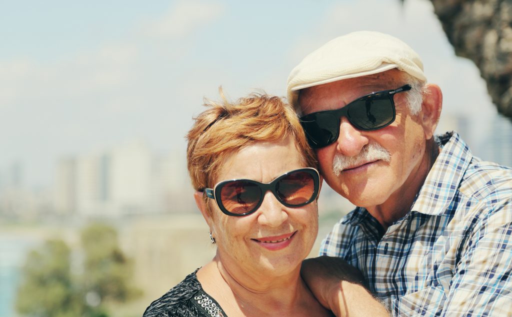 Senior couple with sunglasses outdoors