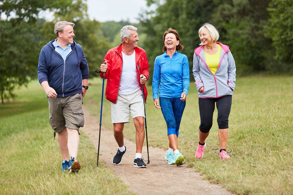 Active seniors walking outside.