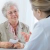 Female doctor explaining diagnosis to his senior-citizen patient