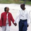 African american couple smiling and walking together hand in hand