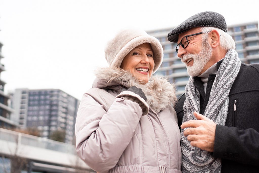 Couple in warm winter clothes enjoying the outdoors on a coudy day in the city.